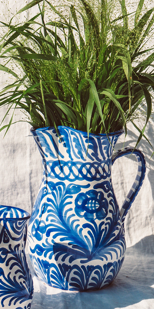 Large pitcher with hand painted designs